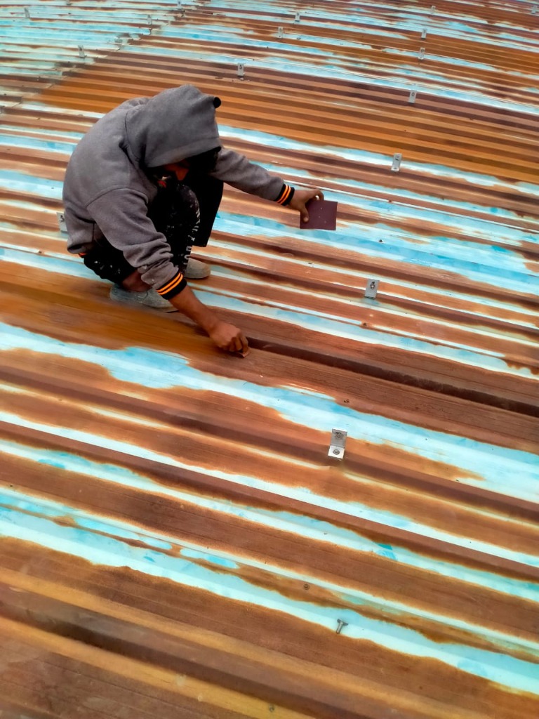 Industrial Metal Roof Rust Treatment and Protective Coating by S.K. Enterprises